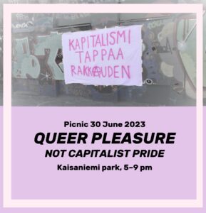 Image: A Banner with the text "Capitalism kills love" hangs on a wall full of graffiti. Image text: same as below.